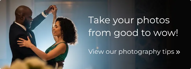 A couple dancing intimately, backlit by a spotlight